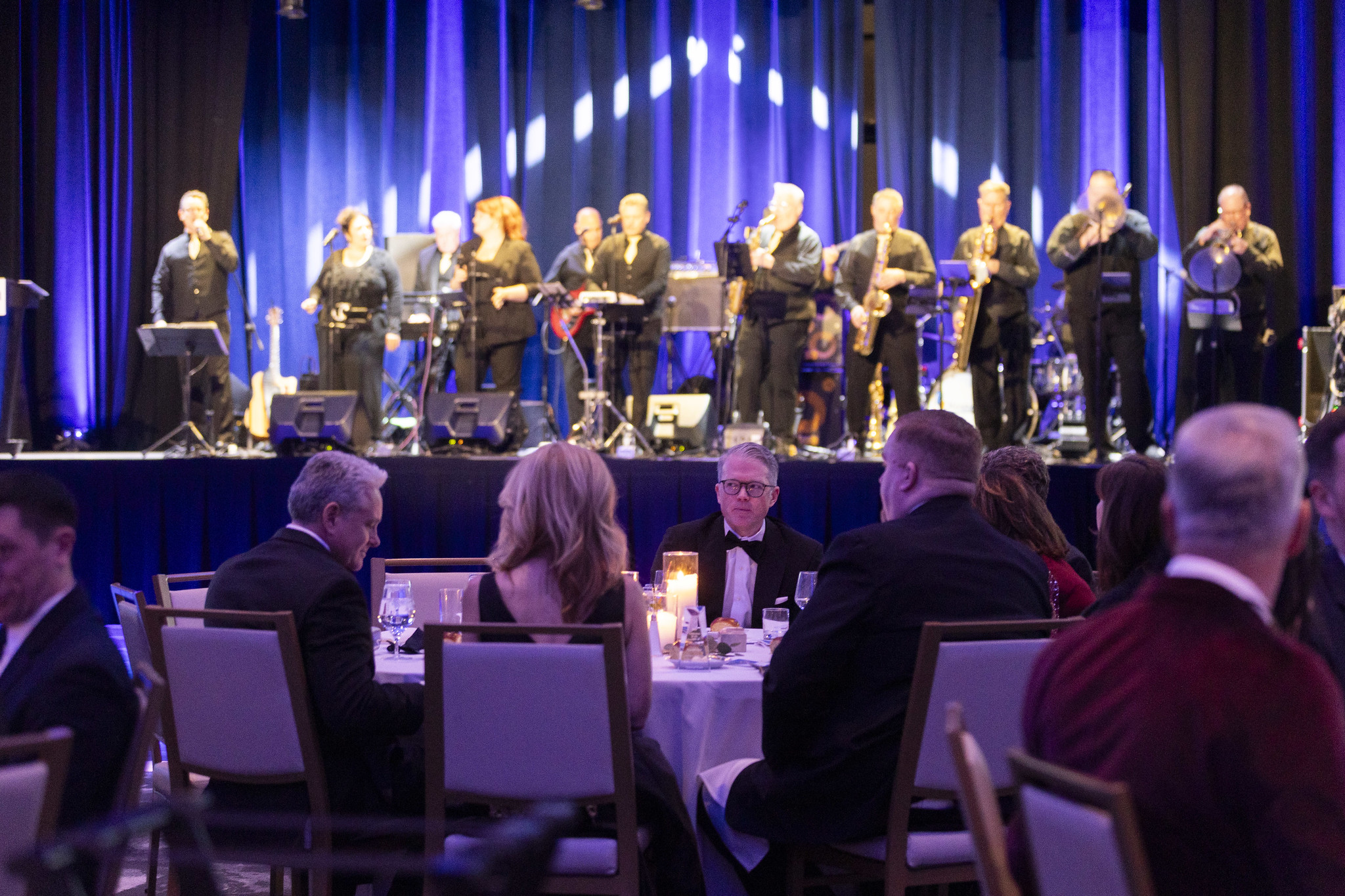 Masquerade live band energizing the wedding dance floor