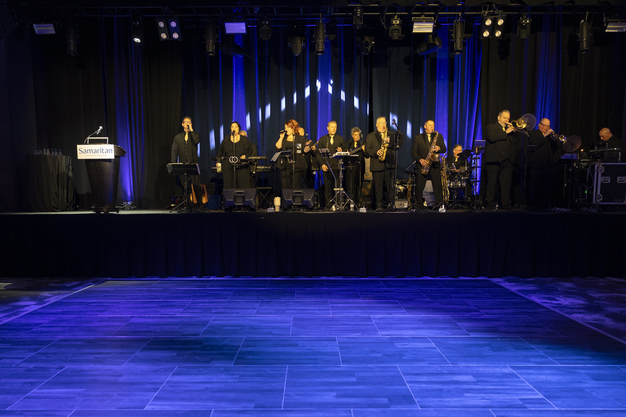 Masquerade 13-piece band performing at elegant wedding ballroom