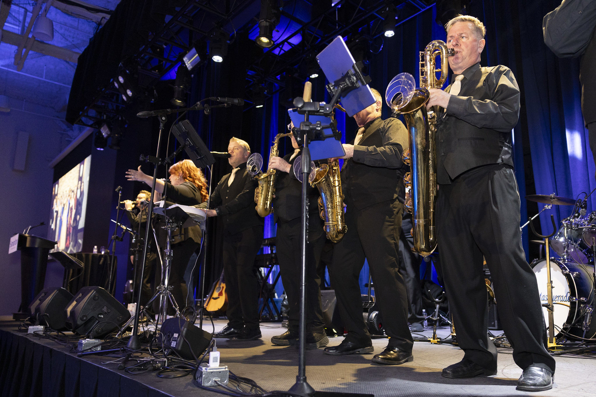Masquerade wedding band on stage with full lighting production